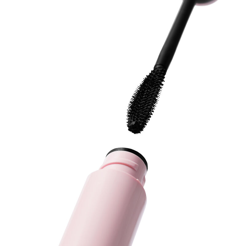 Curved brush with black mascara descending to open pink tube of Mary Kay&reg; Great Heights&trade; Mascara  image number null
