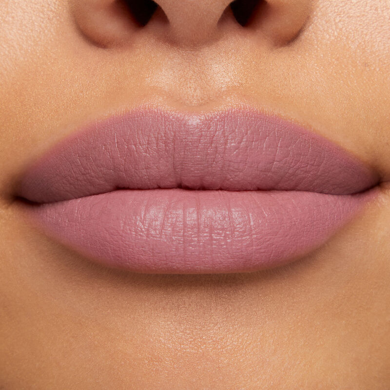Close-up of lips with medium skin tone wearing Mary Kay At Play Matte Liquid Lip Color in shade Almost Pink