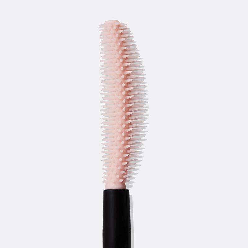 Close-up of pink curved brush for Mary Kay&reg; Great Heights&trade; Mascara standing up image number null