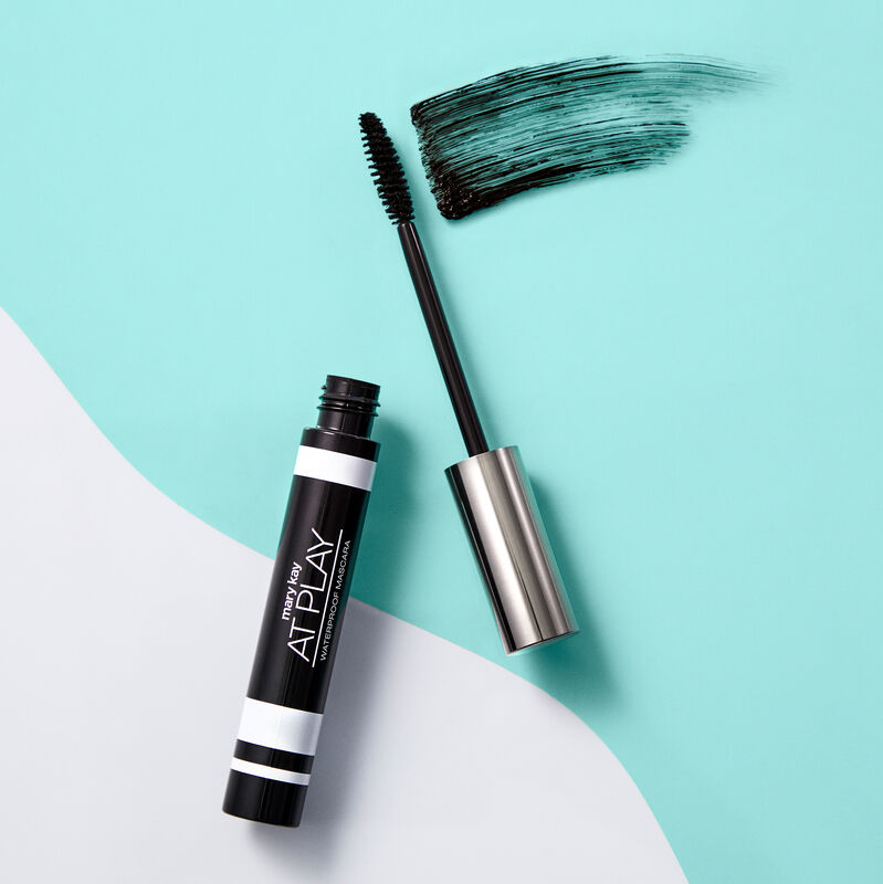 Open tube of Mary Kay At Play Waterproof Mascara with accompanying wand and product rub image number null