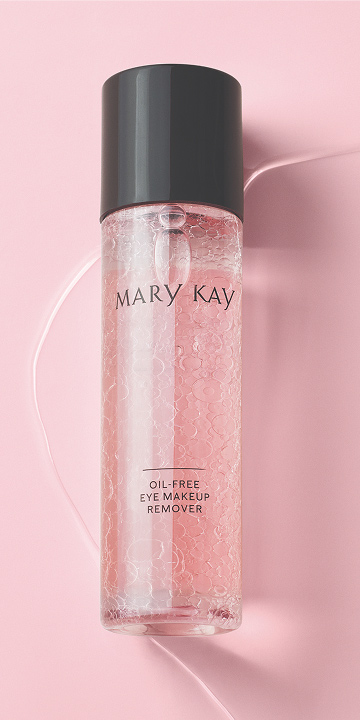 Botella de la Loci&oacute;n Desmaquillante de Ojos Libre de Aceite Mary Kay&reg; agitada sobre fondo rosa