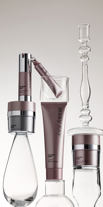 Woman with radiant mature skin applying eye cream